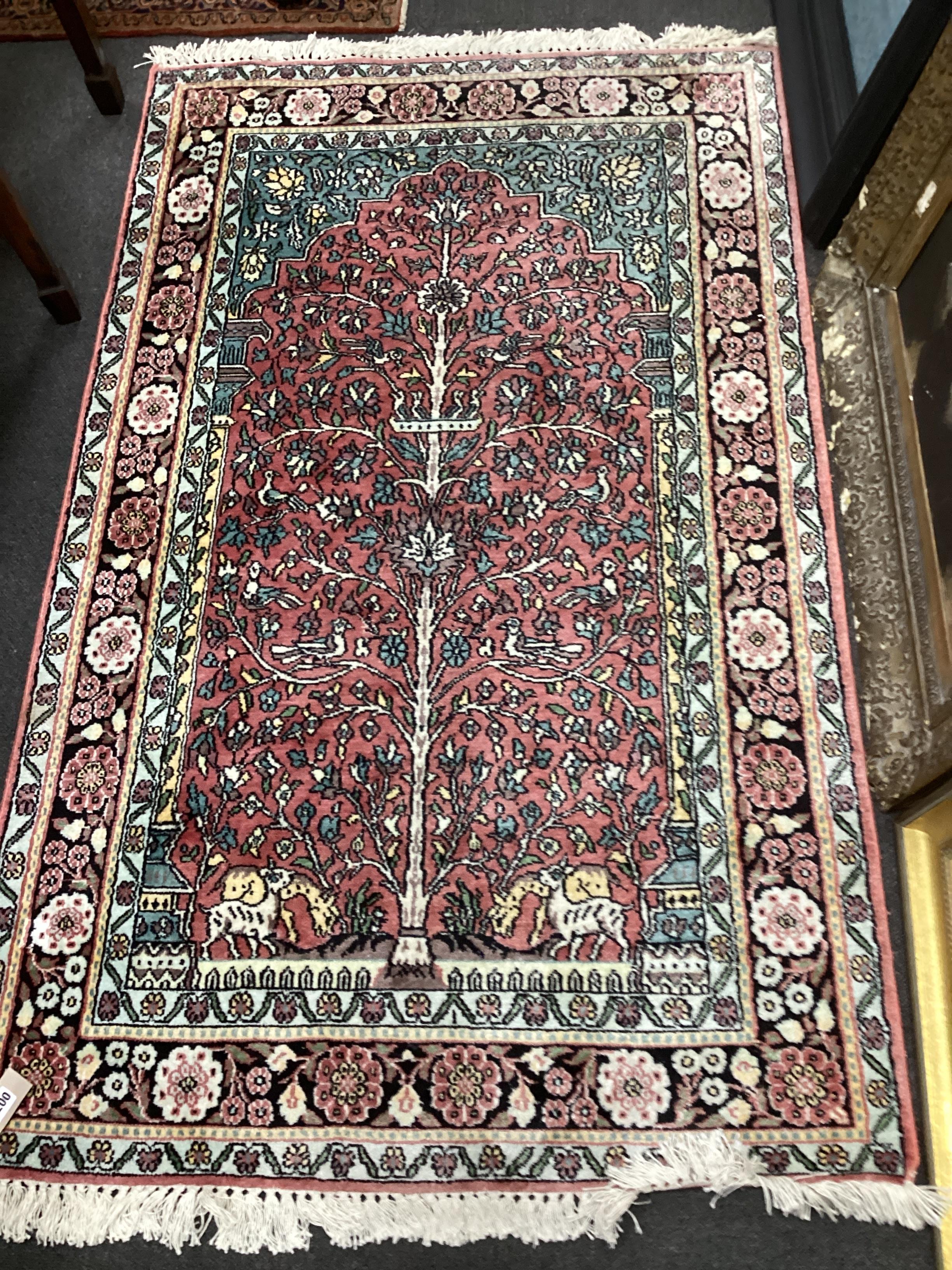 A North West Persian red ground 'tree of life' rug, 154 x 95cm